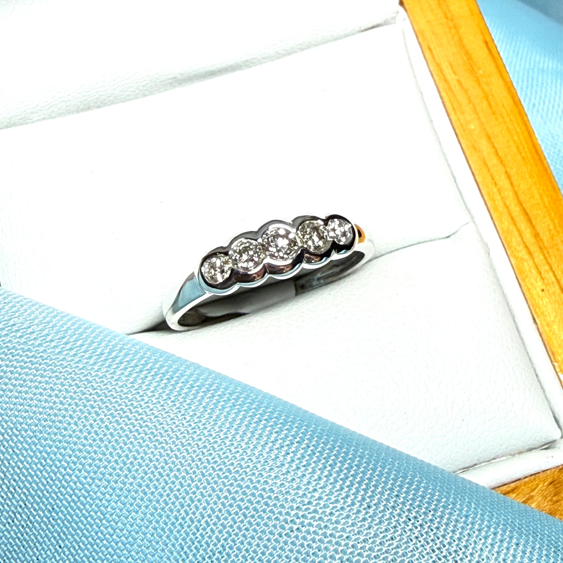 White gold round cut eternity ring diamond rubbed over setting 27 points