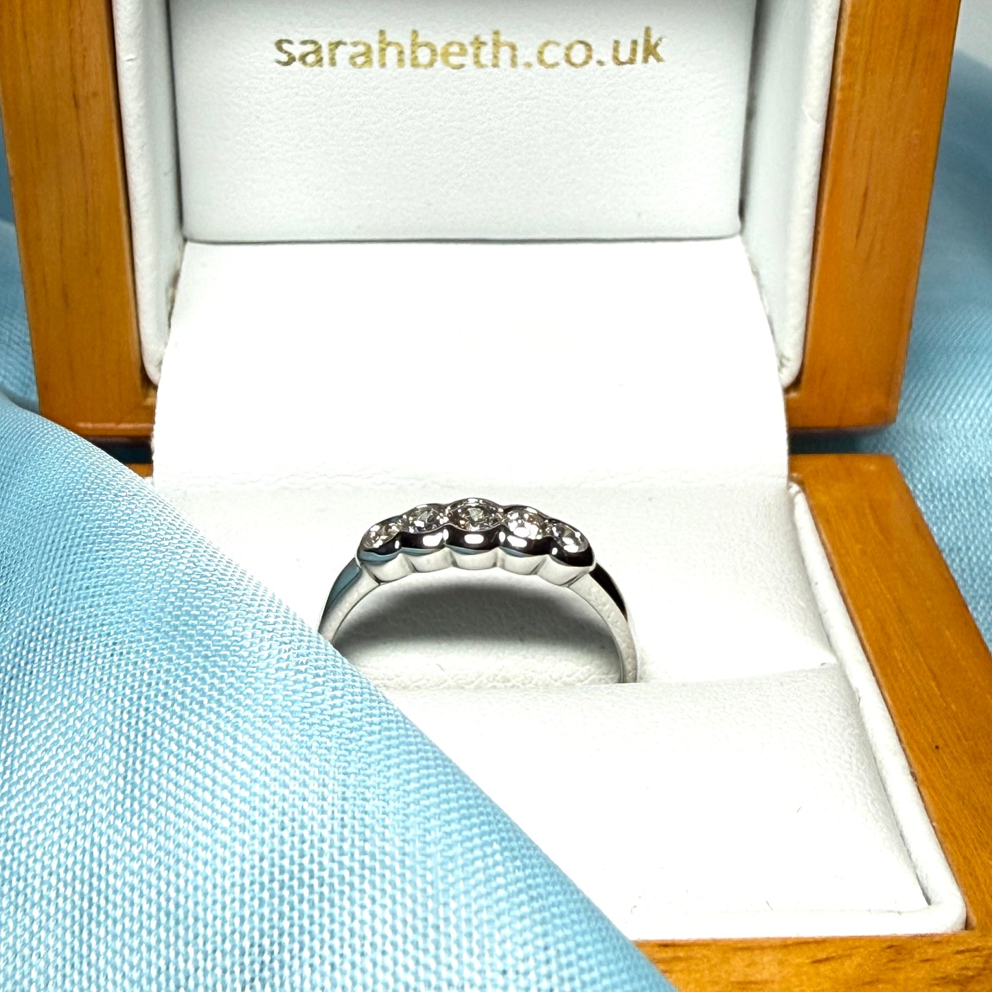 White gold round cut eternity ring diamond rubbed over setting 27 points