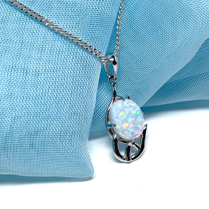 White gold celtic design oval opal necklace