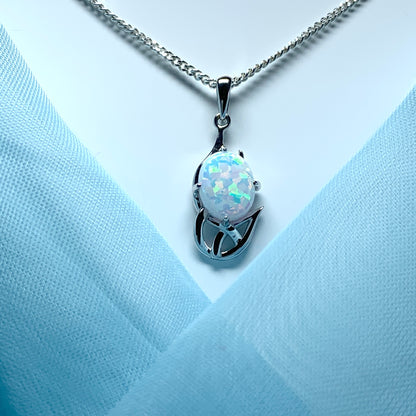 White gold celtic design oval opal necklace