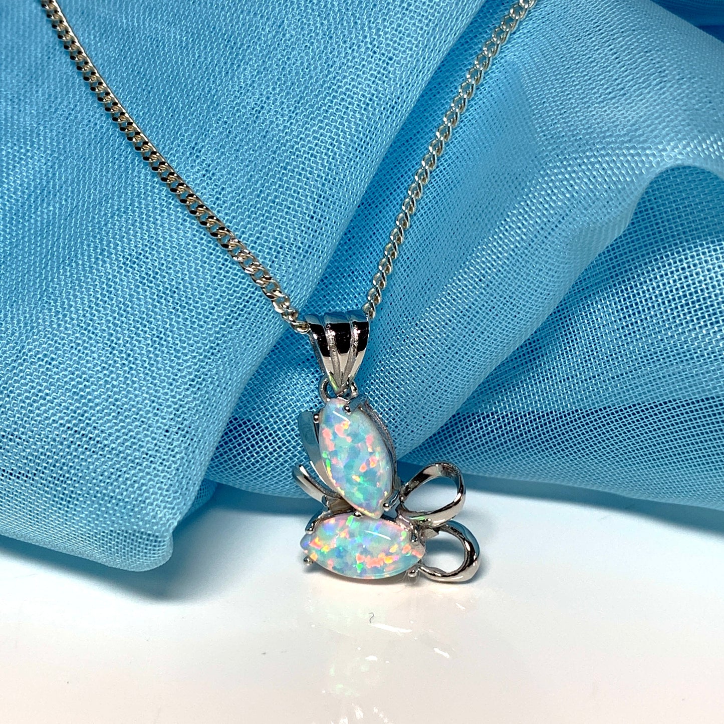 White gold marquise opal swirl necklace