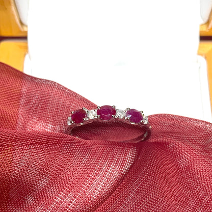 White gold oval ruby and diamond eternity ring