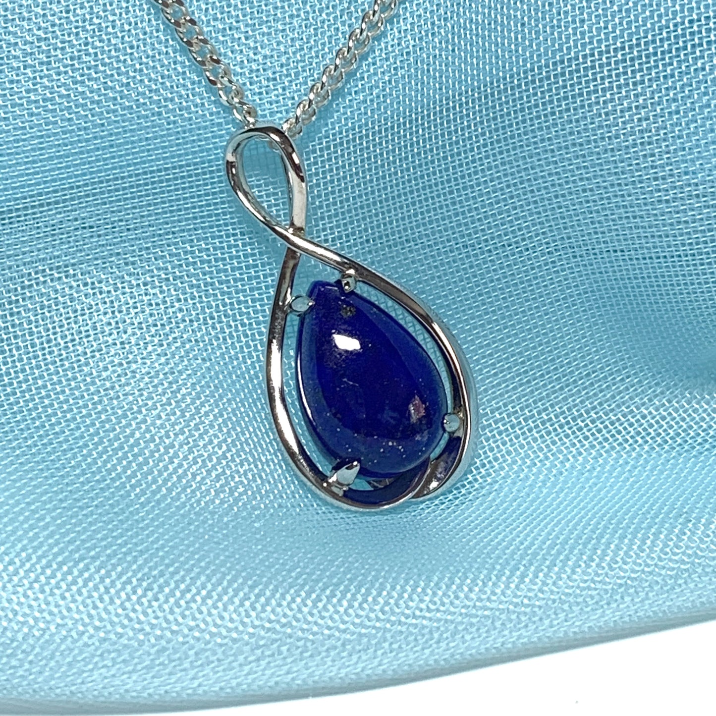 White gold pear teardrop shaped blue lapis lazuli necklace pendant