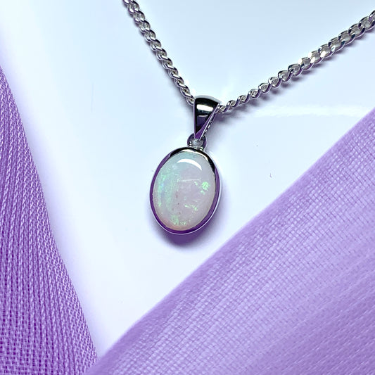 White gold real oval opal rubbed over necklace
