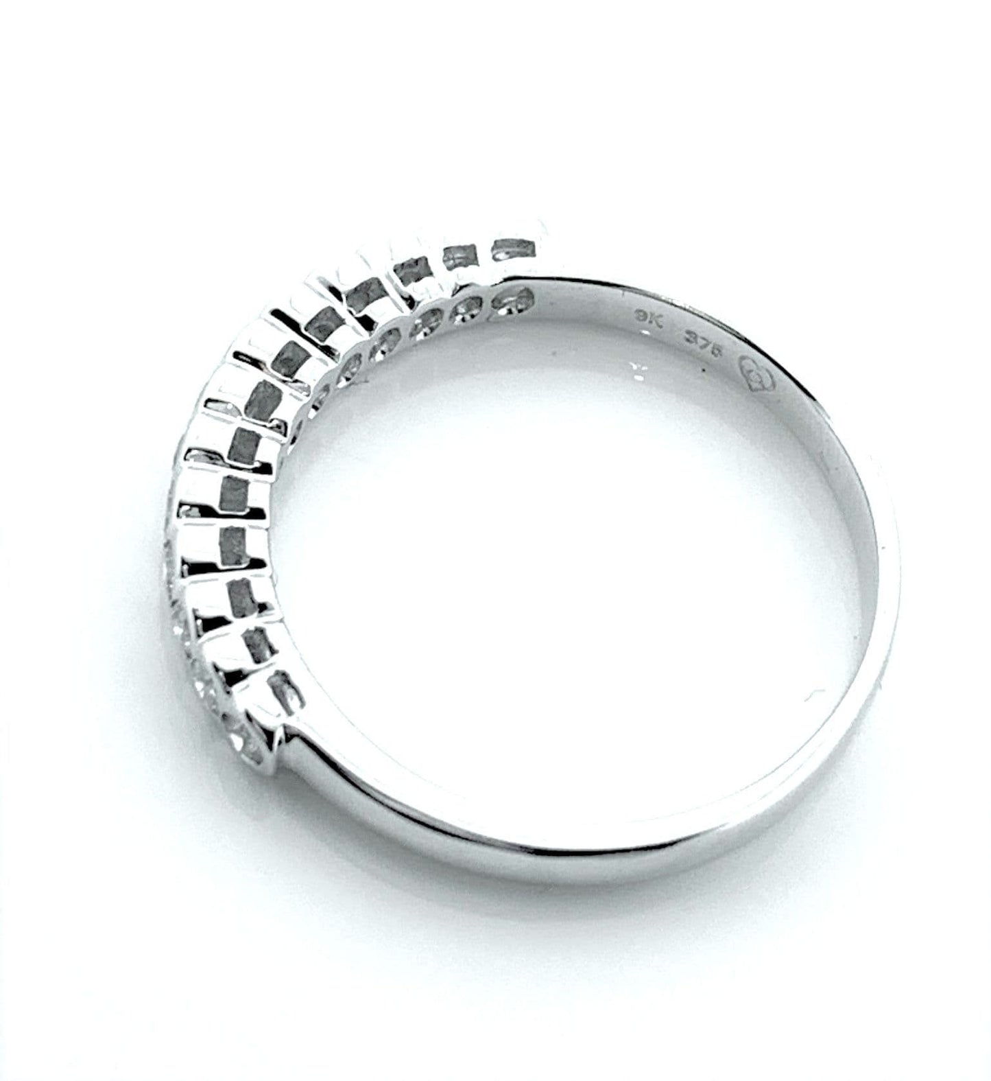 White gold round cut eternity ring diamond rubbed over setting