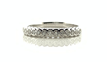 White gold round cut eternity ring diamond rubbed over setting