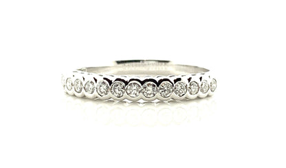 White gold round cut eternity ring diamond rubbed over setting