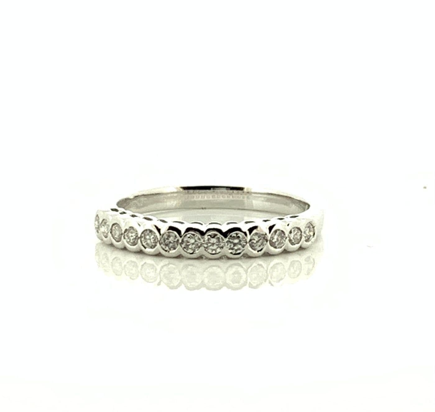 White gold round cut eternity ring diamond rubbed over setting