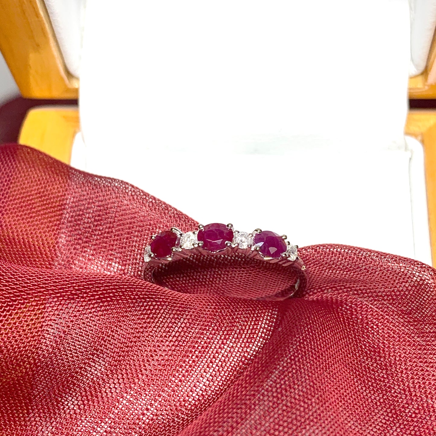 White gold oval ruby and diamond eternity ring