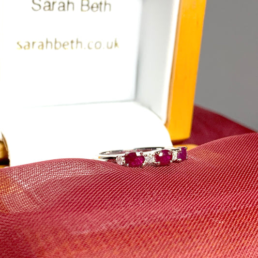 White gold oval ruby and diamond eternity ring