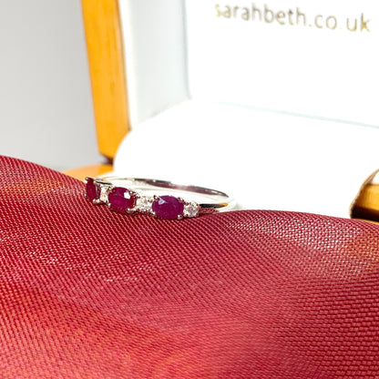 White gold oval ruby and diamond eternity ring