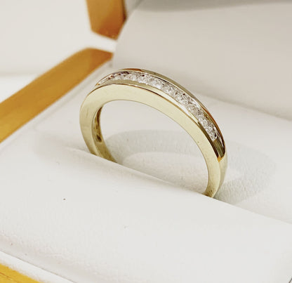 Yellow gold diamond eternity ring channel setting 25 points