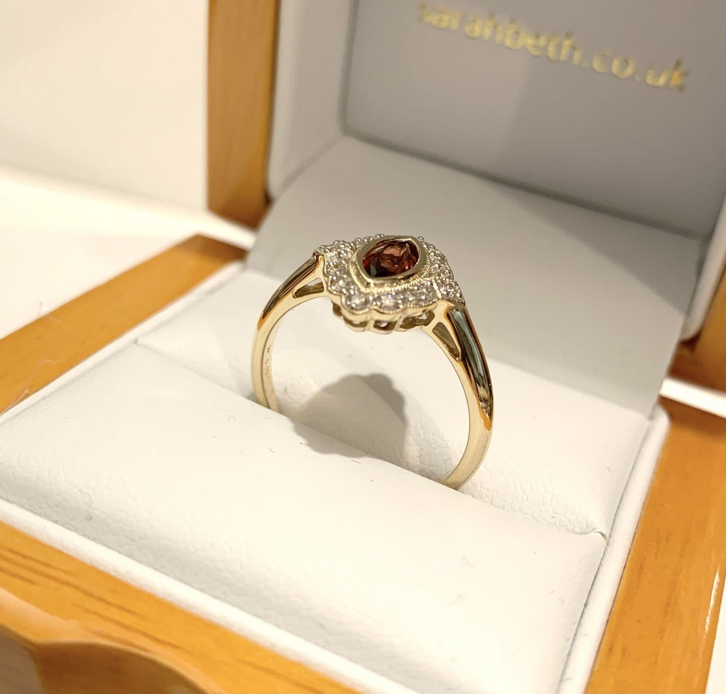 Yellow gold marquise garnet and diamond cluster ring