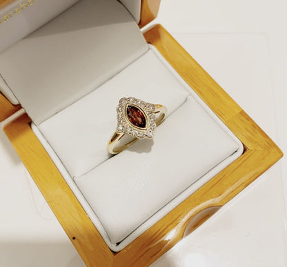 Yellow gold marquise garnet and diamond cluster ring