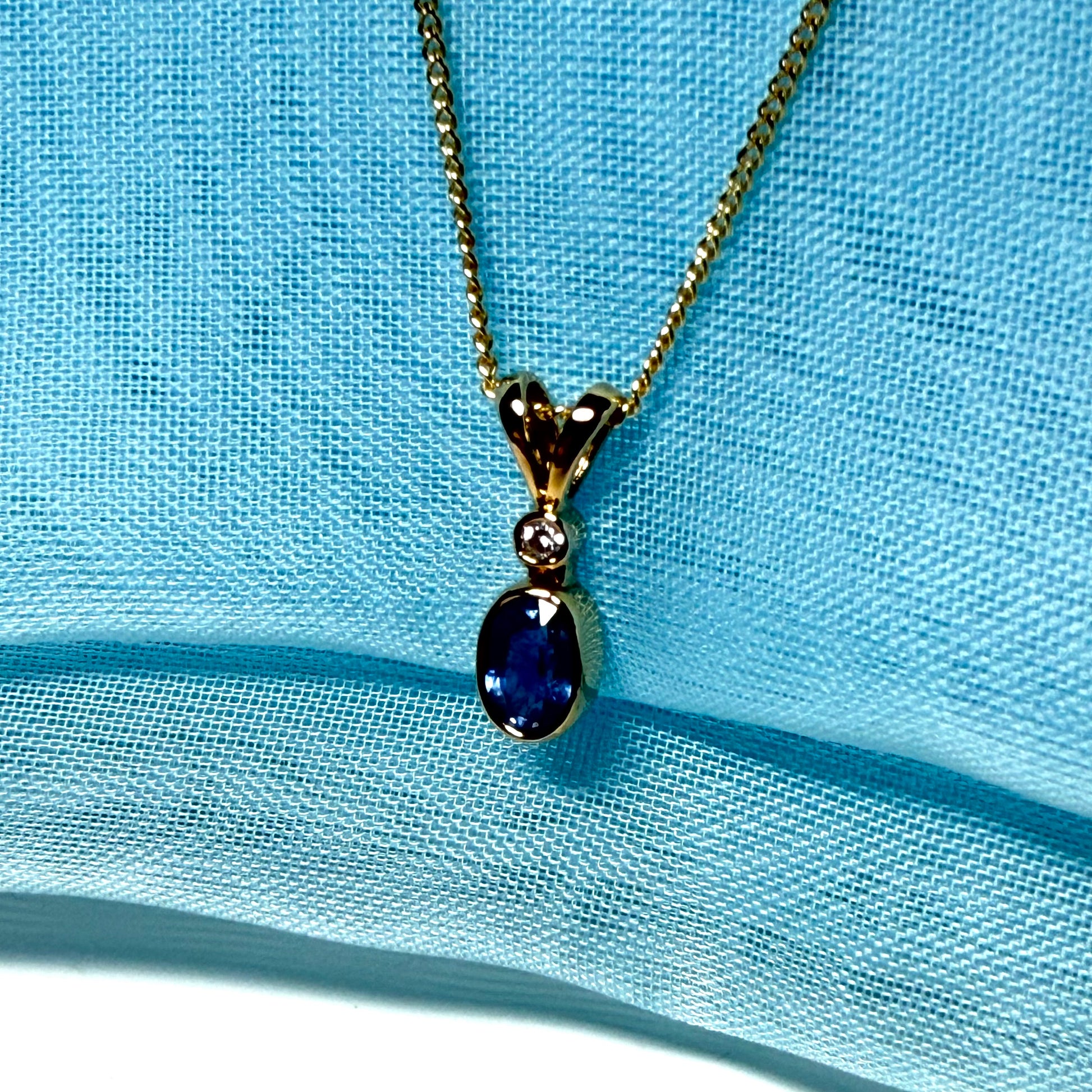 Yellow gold necklace real blue sapphire and diamond round and oval shaped pendant