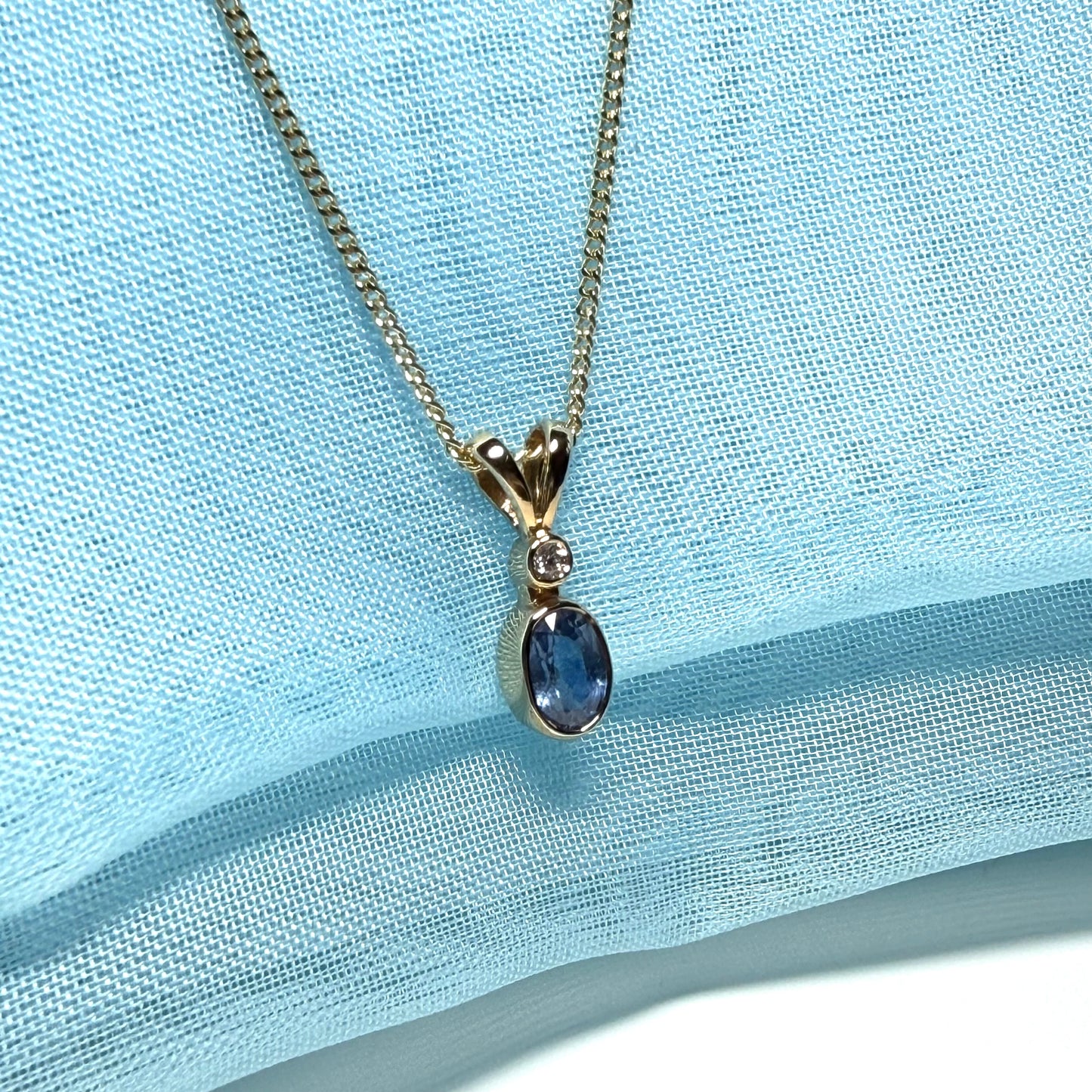 Yellow gold necklace real blue sapphire and diamond round and oval shaped pendant