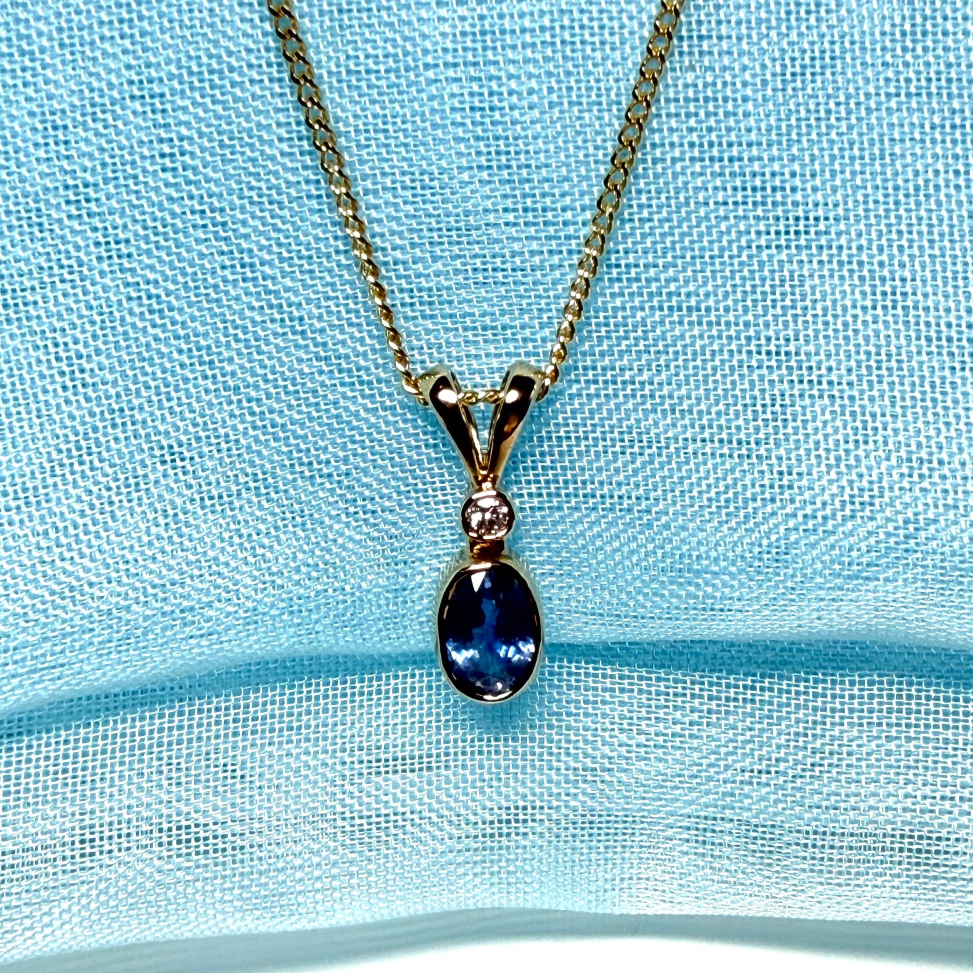 Yellow gold necklace real blue sapphire and diamond round and oval shaped pendant