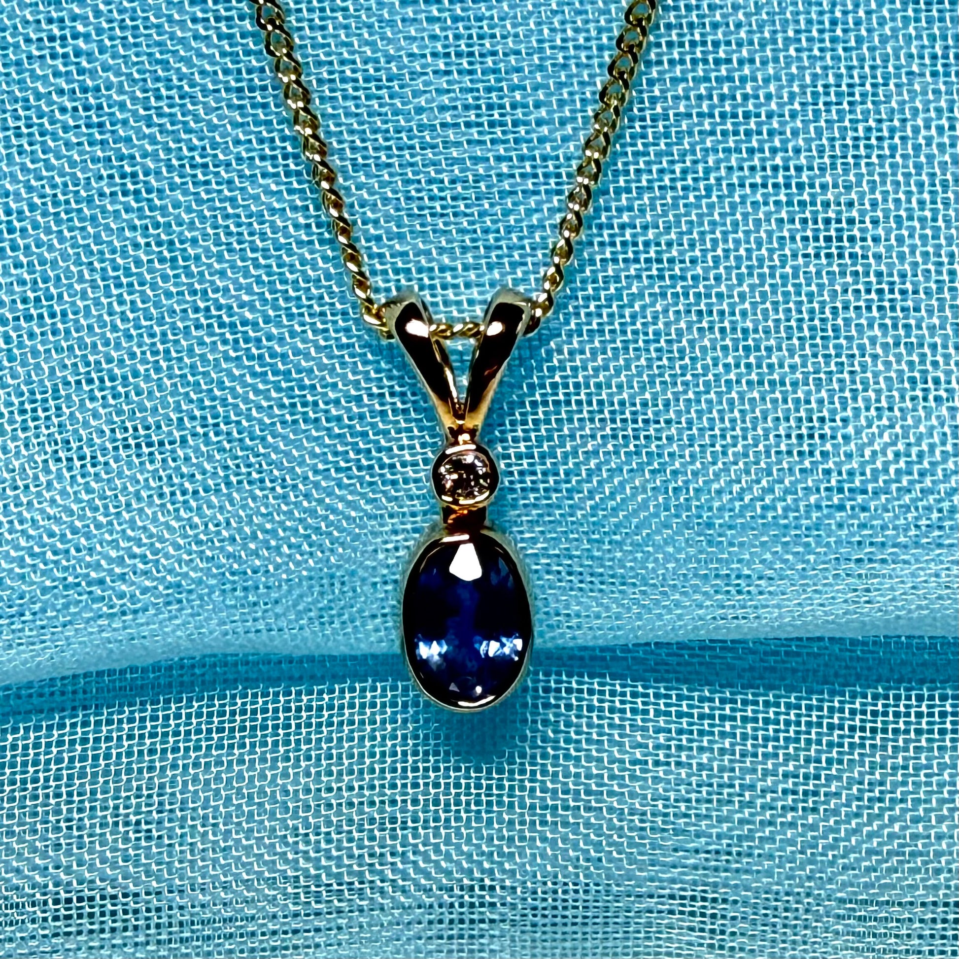 Yellow gold necklace real blue sapphire and diamond round and oval shaped pendant