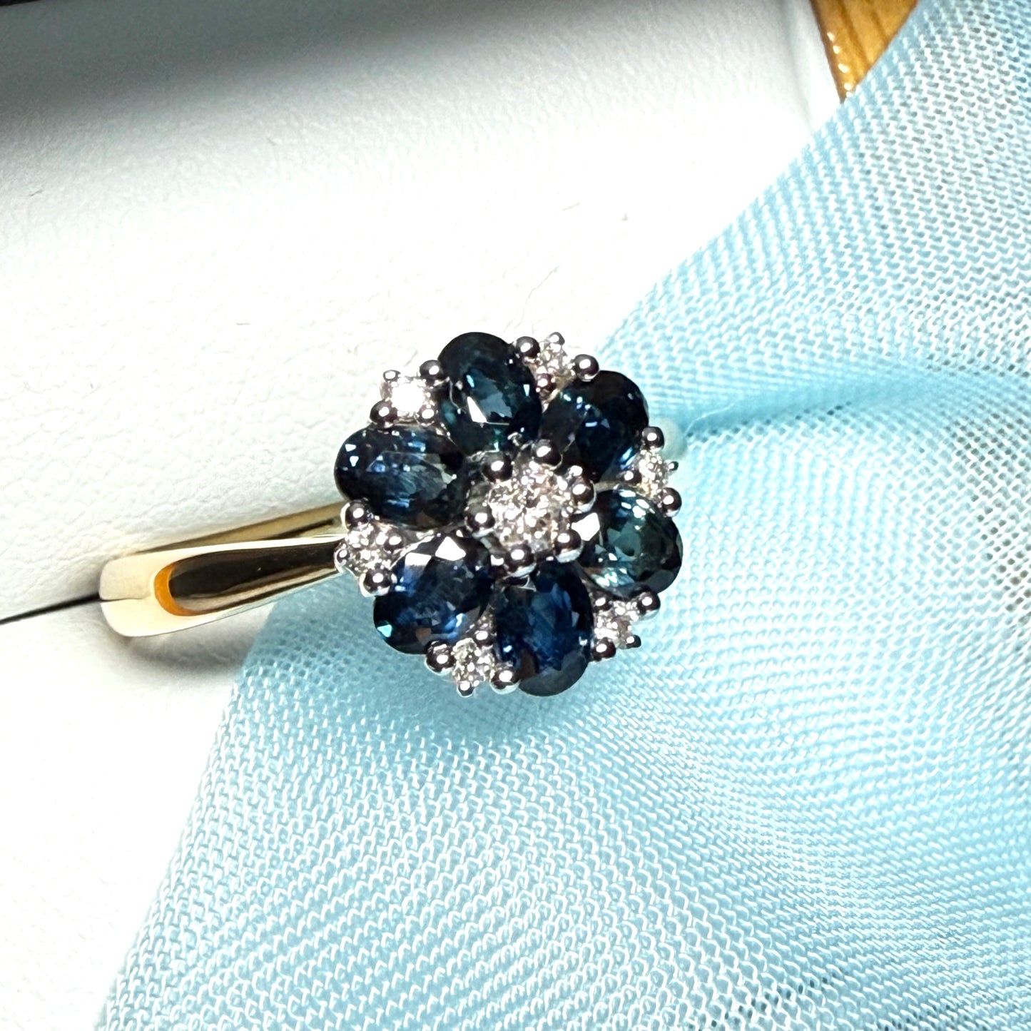 Yellow gold real dark blue sparkling sapphire and diamond round shaped cluster ring