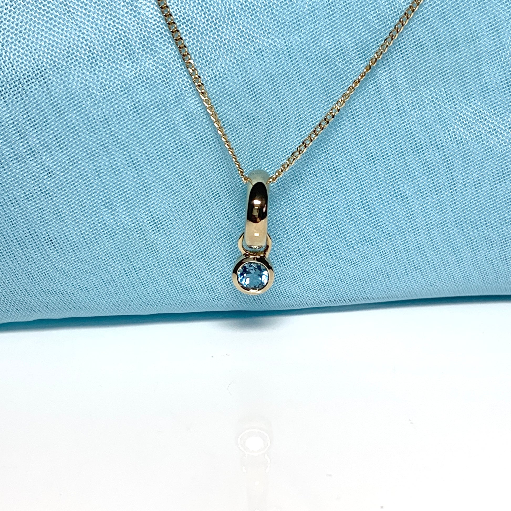 Yellow gold blue topaz circle drop necklace pendent
