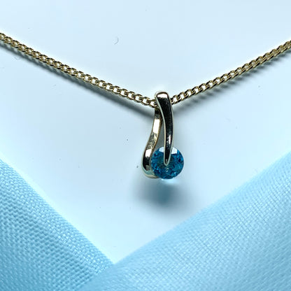 Yellow gold blue topaz necklace pendent