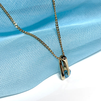 Yellow gold blue topaz necklace pendent