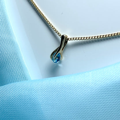 Yellow gold blue topaz necklace pendent