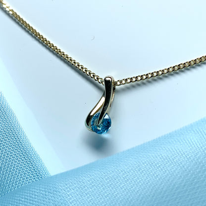 Yellow gold blue topaz necklace pendent