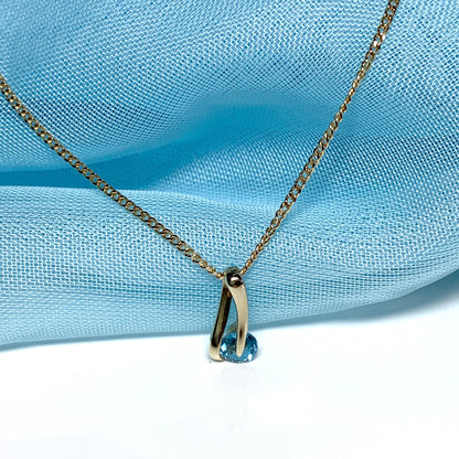 Yellow gold blue topaz necklace pendent