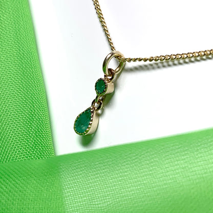 Yellow gold fancy emerald necklace