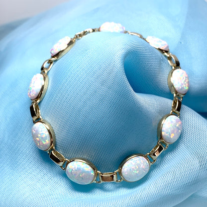 Yellow gold oval opal  bracelet