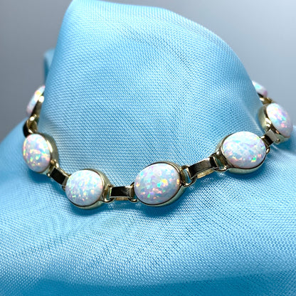 Yellow gold oval opal  bracelet