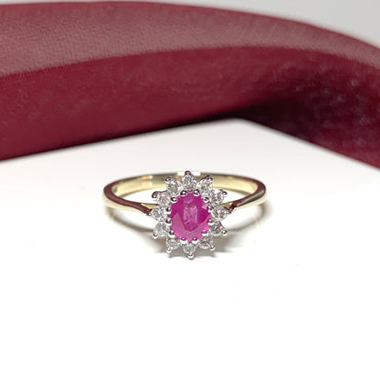 Oval Ruby And Diamond Cluster Ring in Yellow Gold