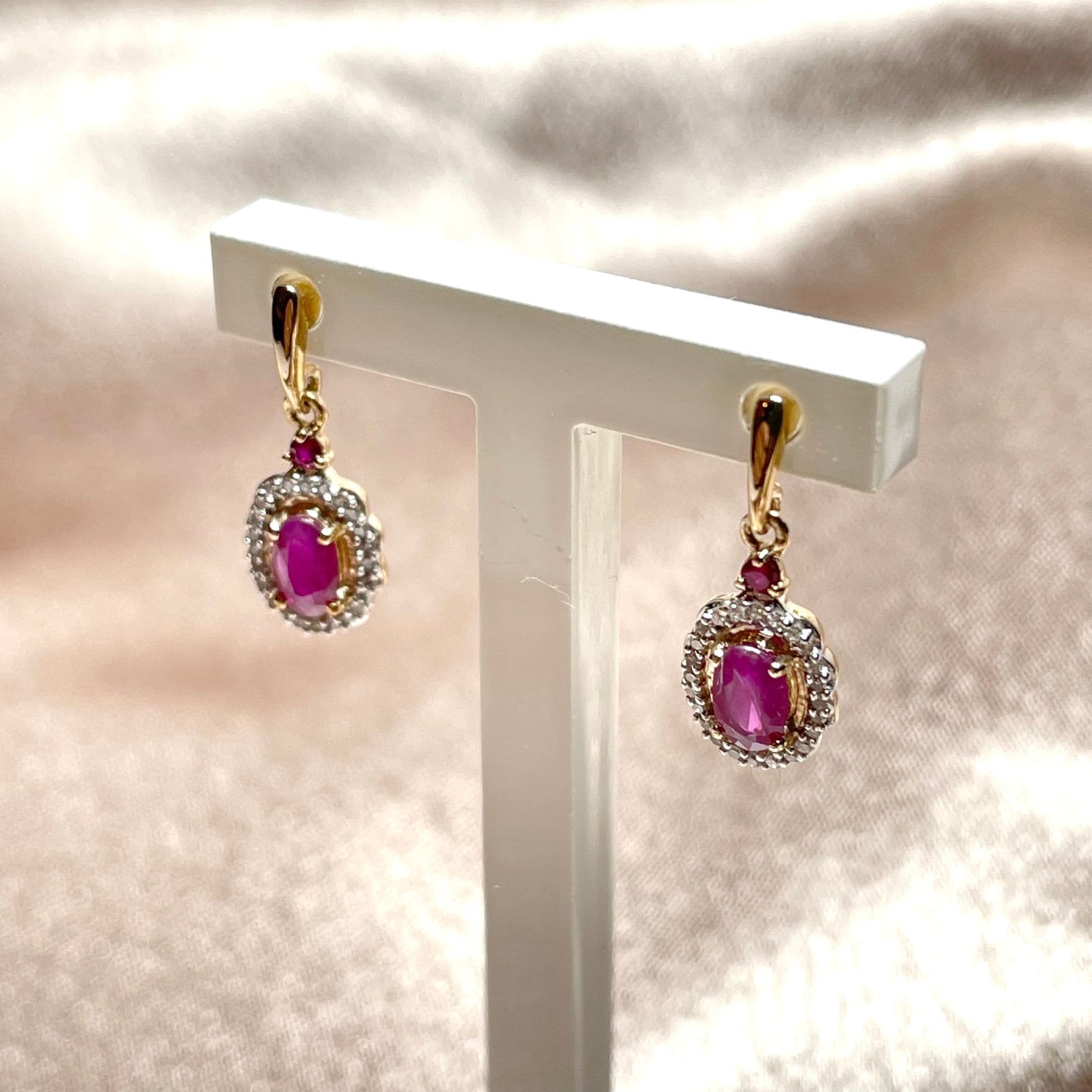 Yellow gold red oval ruby and diamond drop earrings