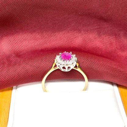 Oval Ruby And Diamond Cluster Ring in Yellow Gold