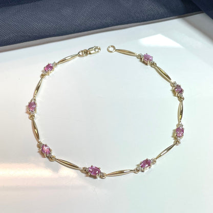 Pink sapphire and diamond yellow gold bracelet