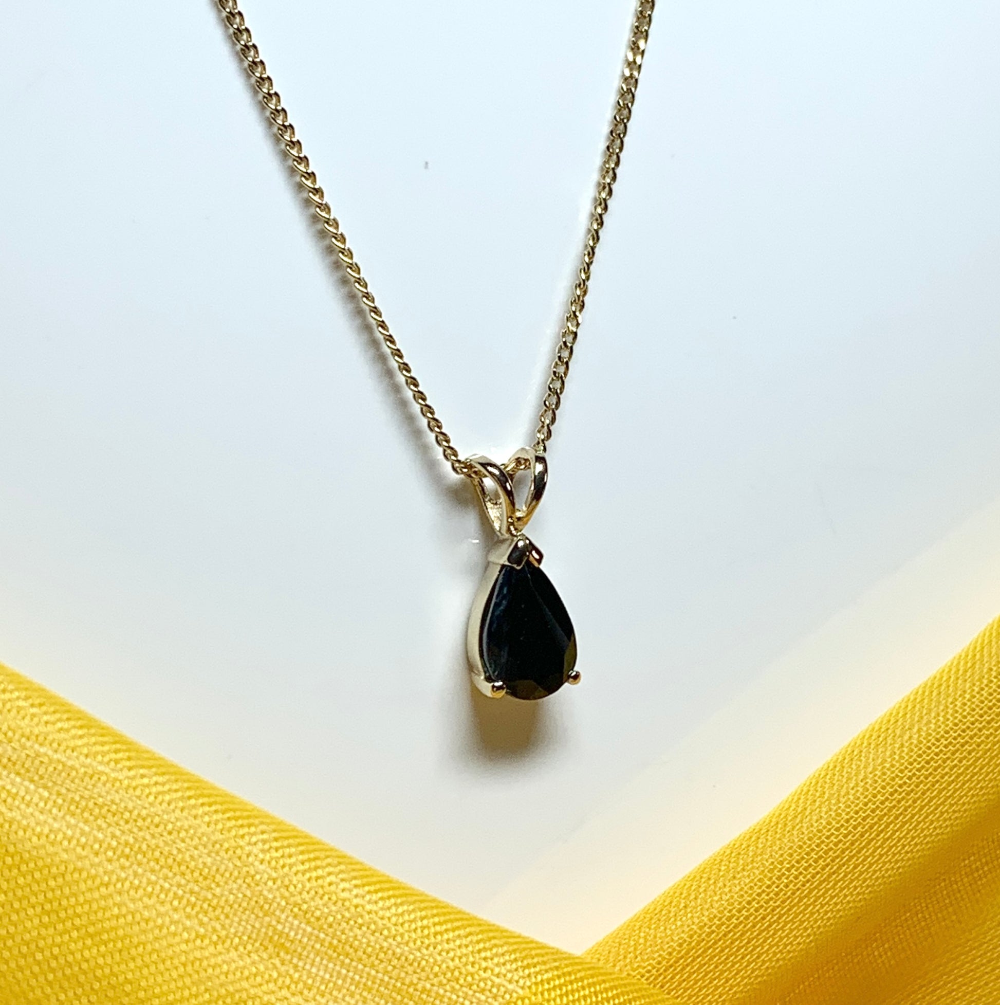 Yellow gold sapphire pear shaped necklace pendant