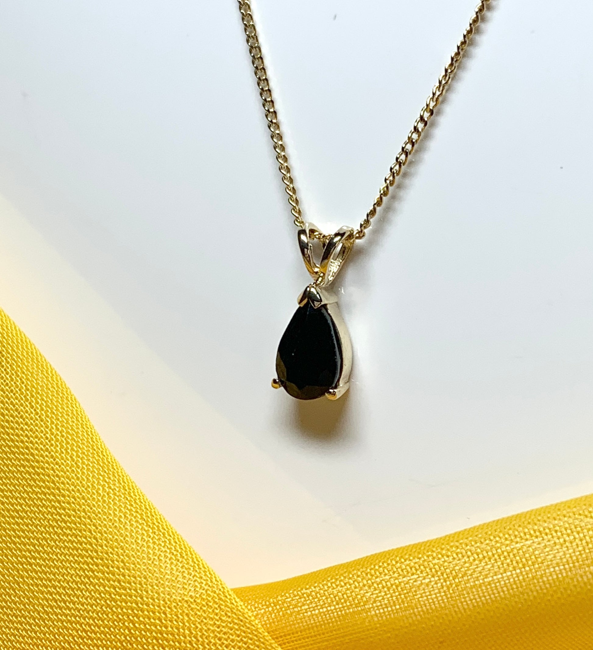 Yellow gold sapphire pear shaped necklace pendant