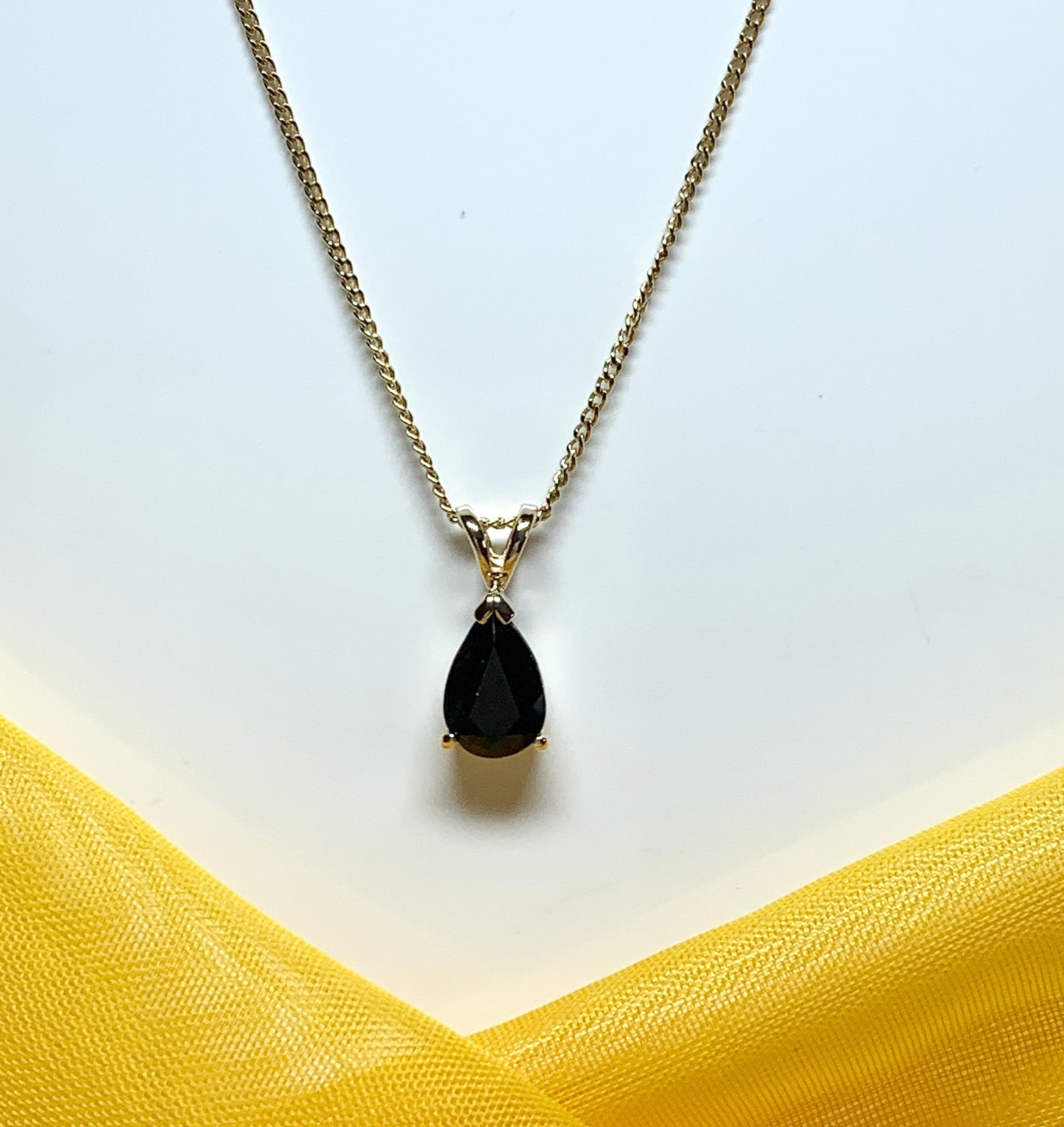 Yellow gold sapphire pear shaped necklace pendant