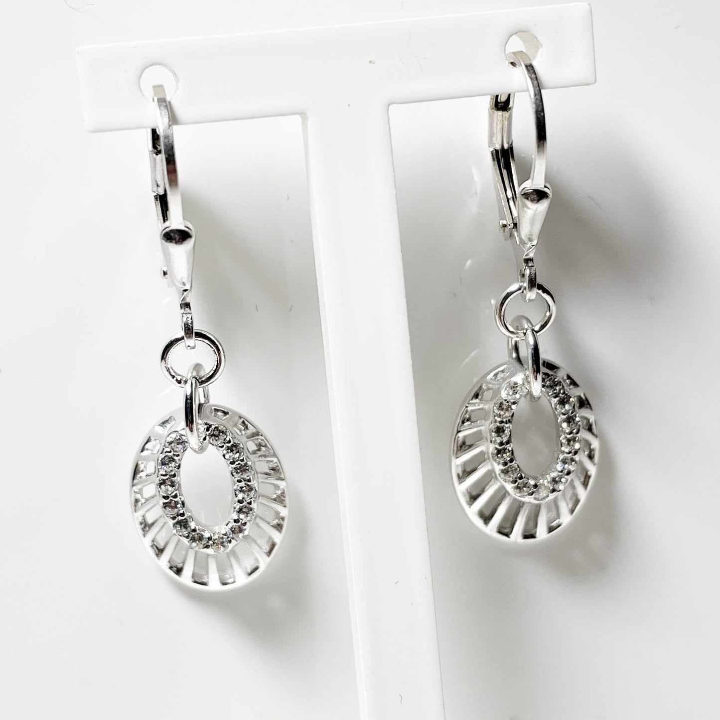 an Oval shaped cubic zirconia sterling silver drop earrings