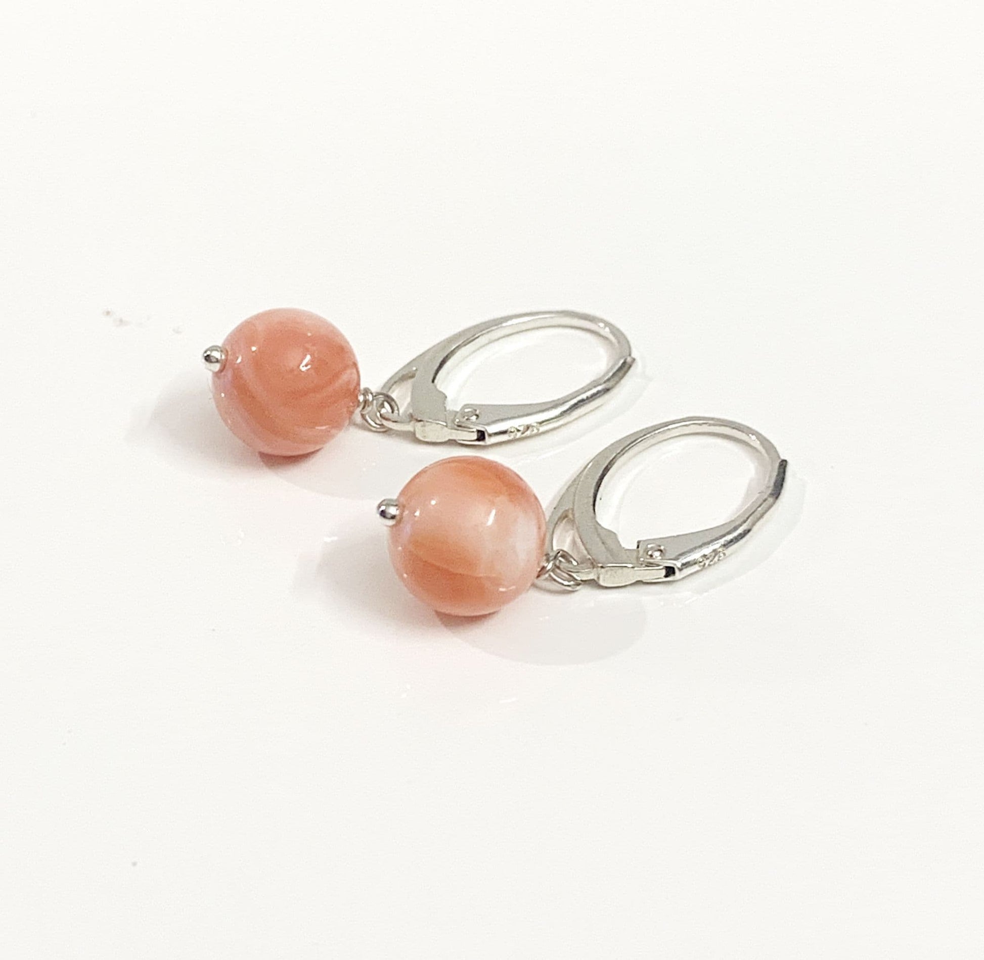 Coral round sterling silver drop earrings