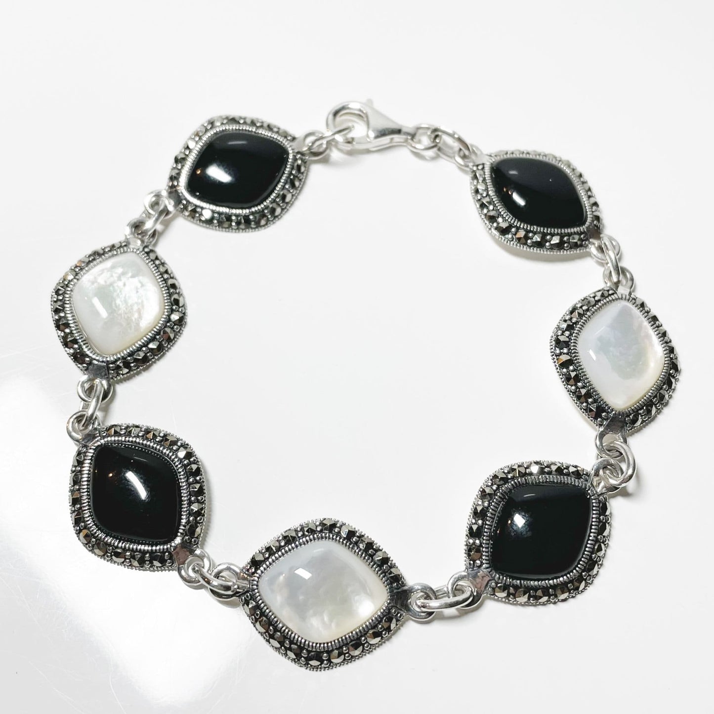 Mother of pearl marcasite and onyx sterling silver three row ladies bracelet