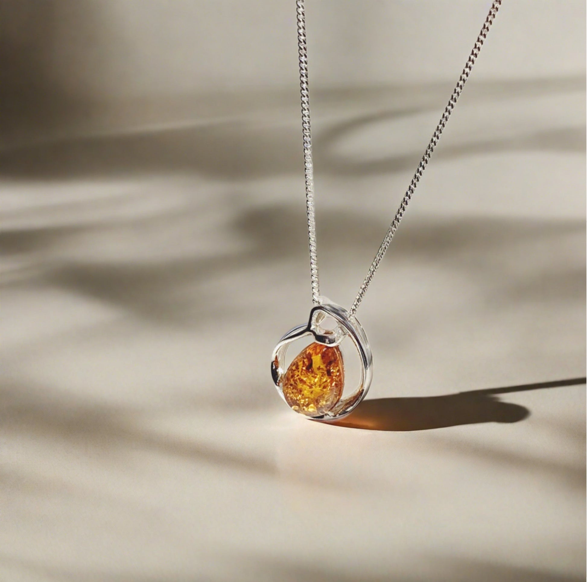 Orange amber fancy tear drop sterling silver necklace