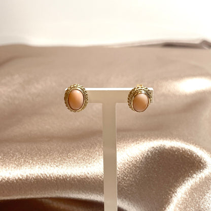 Oval coral yellow gold stud earrings