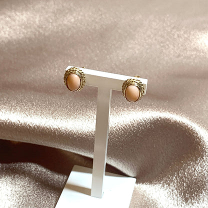 Oval coral yellow gold stud earrings