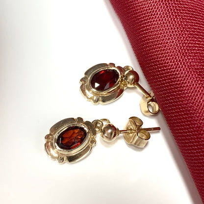 Garnet drop earrings oval picture framed yellow gold