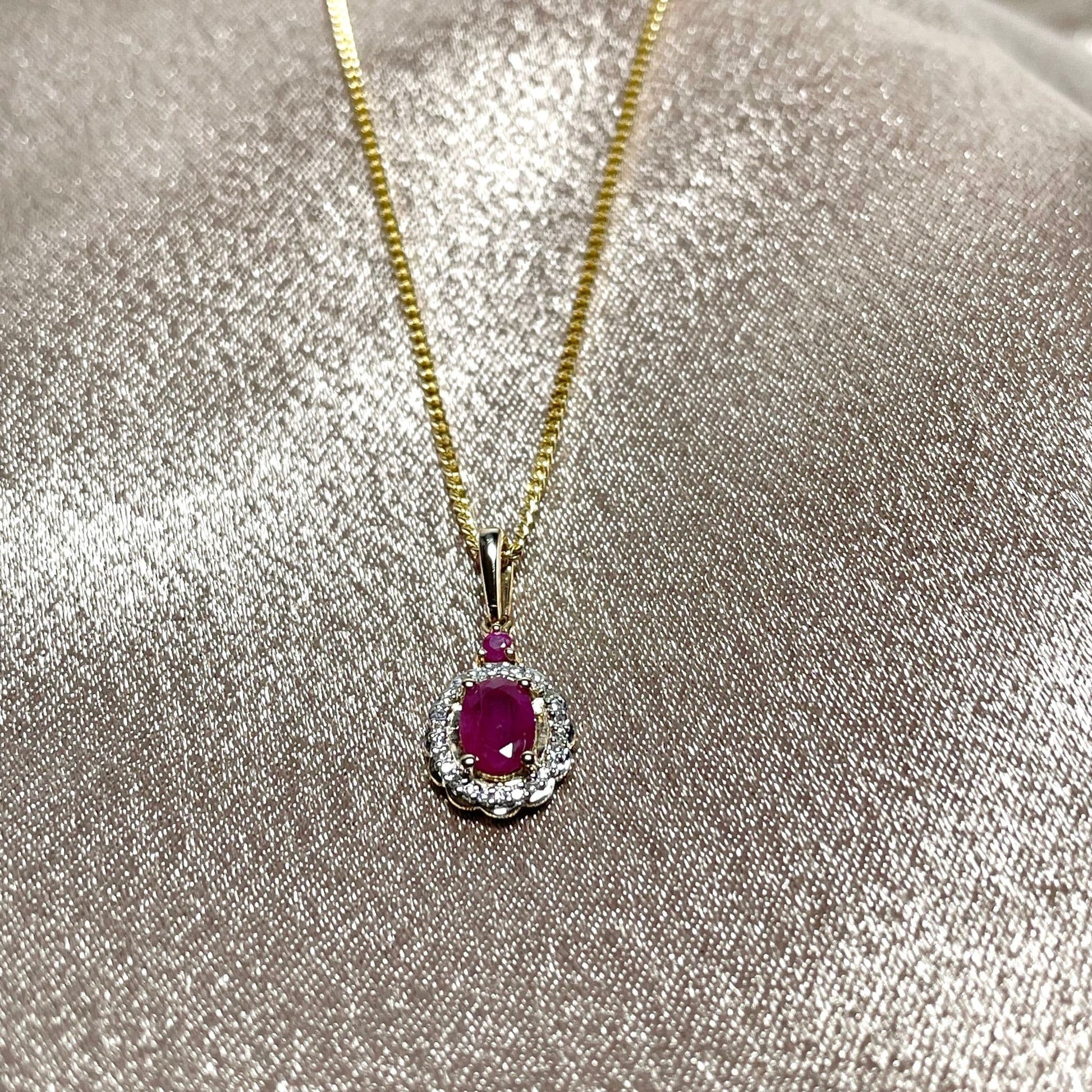 Oval red ruby and diamond necklace yellow gold