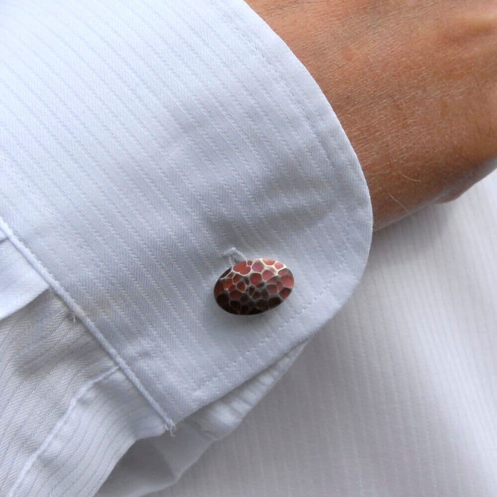 Oval solid titanium brown dotted cufflinks