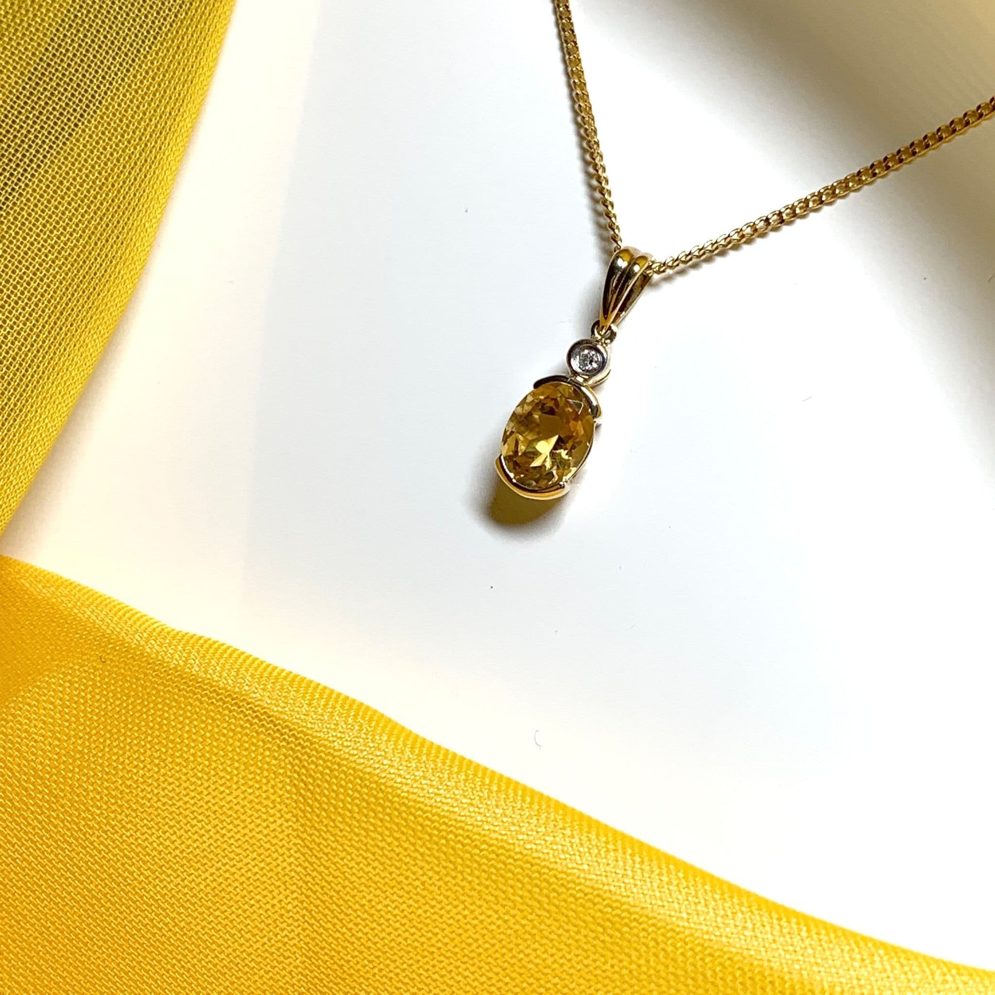 Oval yellow citrine and diamond gold necklace