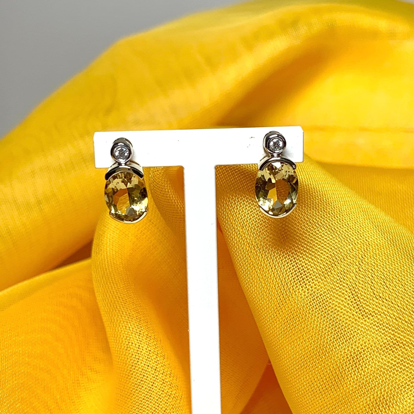 Oval yellow citrine and diamond gold stud earrings